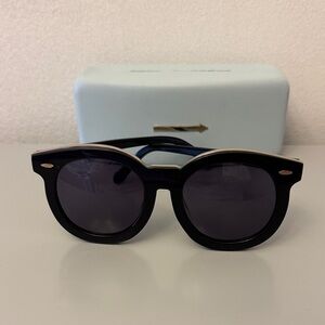 Karen Walker oversized tinted sunglasses.